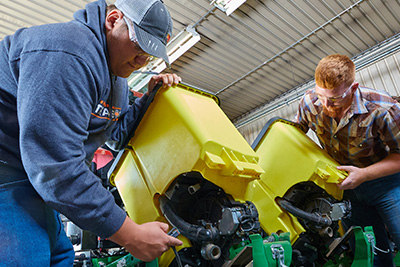 Students working on planter